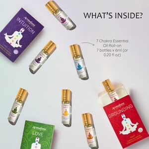 May include: Set of seven 0.20 fl oz essential oil roll-on bottles with colorful labels featuring chakra symbols and names like "Intuition", "Love", and "Grounding".