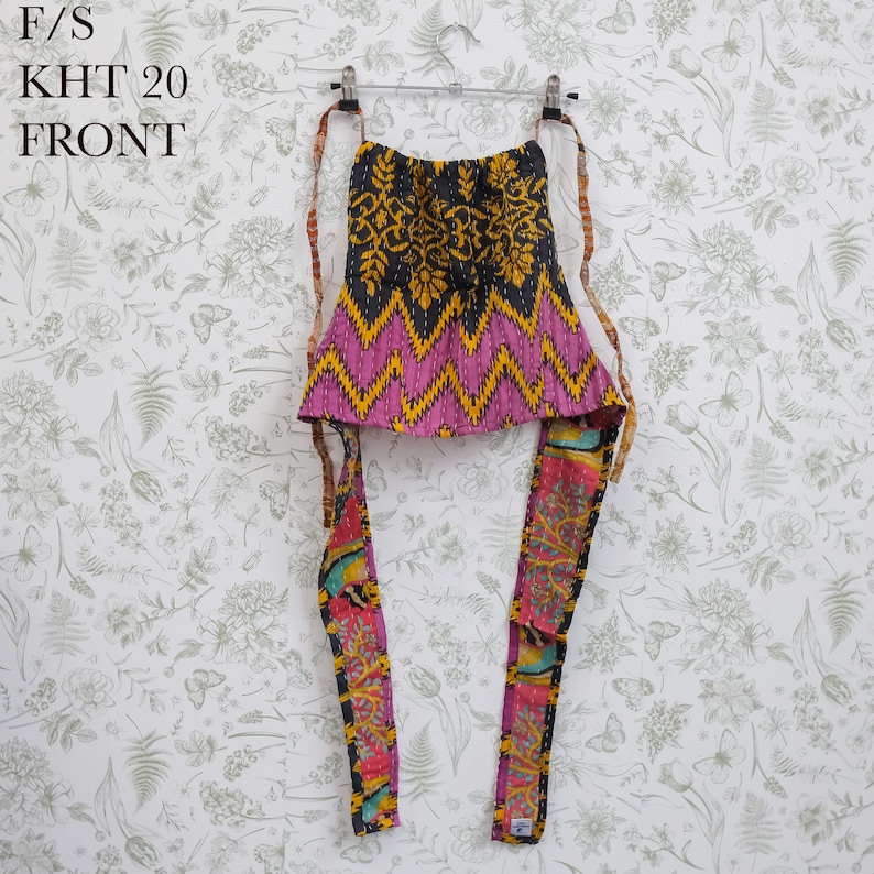 May include: A sleeveless halter top featuring a black and yellow floral upper section, a pink and yellow zigzag patterned middle, and long, multicolored patterned ties. The text F/S KHT 20 FRONT is visible in the upper left corner of the image.