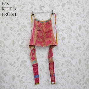 May include: A pink and yellow patterned halter top featuring a geometric design with visible stitching, long fabric ties, and a square neckline. The text F/S KHT 18 FRONT is printed in the upper left corner of the image.