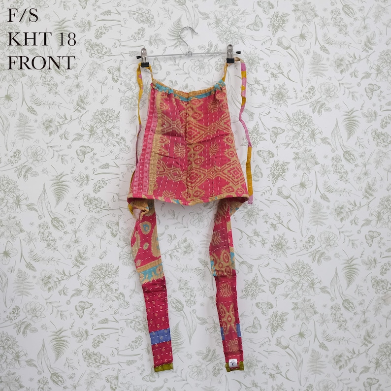 May include: A pink and yellow patterned halter top featuring a geometric design with visible stitching, long fabric ties, and a square neckline. The text F/S KHT 18 FRONT is printed in the upper left corner of the image.
