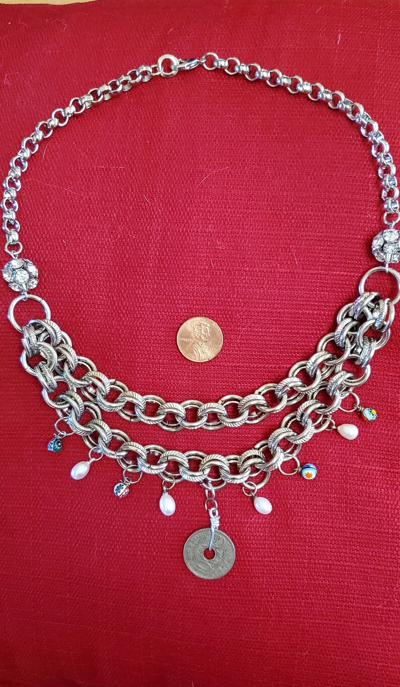 Multi-strand silver-toned necklace with charm beads
