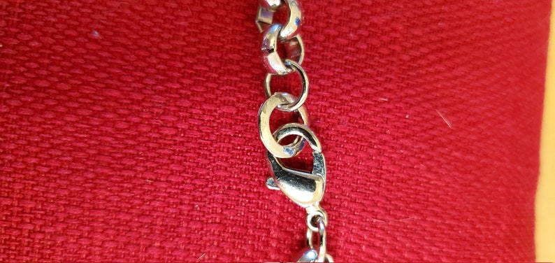 Multi-strand silver-toned necklace with charm beads