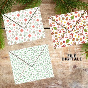 May include: Three folded paper envelopes featuring festive holiday patterns. One envelope displays red and green gift boxes, another shows Santa Claus with gingerbread men and trees, and the third features a green holly leaf and berry pattern.