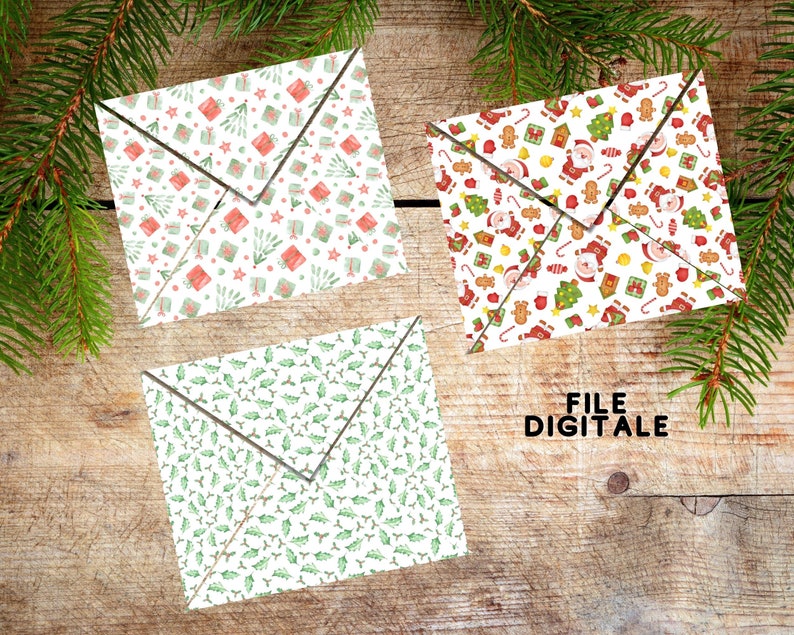 May include: Three folded paper envelopes featuring festive holiday patterns. One envelope displays red and green gift boxes, another shows Santa Claus with gingerbread men and trees, and the third features a green holly leaf and berry pattern.