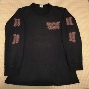 May include: Black long-sleeved shirt with a red and white graphic print of "Morbid Creation" on the front and the same graphic print on both sleeves.
