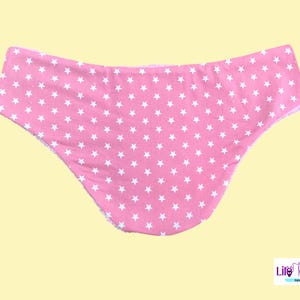May include: Pink underwear with a white star pattern.