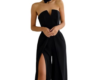 May include: A black strapless jumpsuit with a plunging neckline and a high slit on each leg.