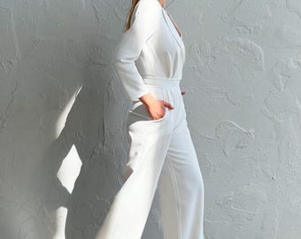 White Long Sleeve Jumpsuit Deep V Neck Wide Leg Pockets