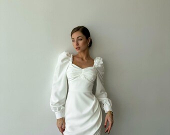 White Bodycon Mini Dress with Long Sleeves and Sweetheart Neckline White Bodycon Mini Dress with Long Sleeves and Sweetheart Neckline