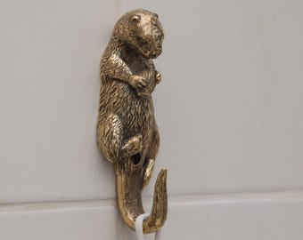 Solid Brass Otter Wall Hook Holding Shell, Handmade Animal Decor for Keys, Towels, Bags.