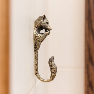 Raccoon Brass Wall Hook: Crafted from Cast Metal, Sturdy, Durable, and Exquisitely Detailed. Ideal for Hanging Clothes,Towels,Hats,and More.