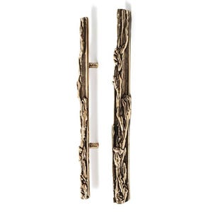 May include: Two vertical cabinet pulls made of bronze-toned metal with a textured, organic surface that mimics the appearance of tree bark. Each handle features a long, slender shape with irregular, raised ridges and deep grooves throughout.