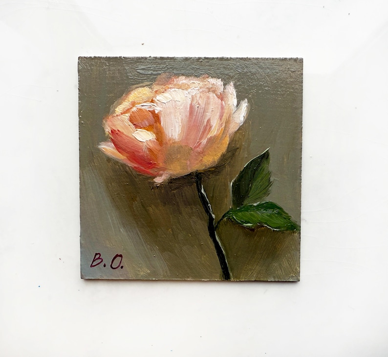 May include: A small painting of a single pink flower with green leaves on a gray background. The painting is signed "B.O."