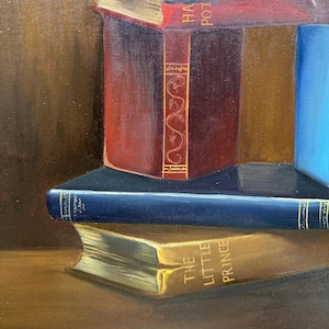 May include: A still life painting of a stack of books. The top book is red and has the words "Harry Potter" on the spine. The middle book is blue and the bottom book is yellow with the words "The Little Prince" on the spine.