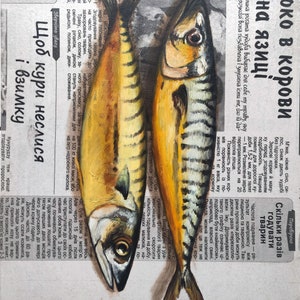 May include: Oil painting of two mackerel fish, side-by-side, on a newspaper background. The fish have yellow and silver scales, with dark eyes and fins. The newspaper text is in Ukrainian.