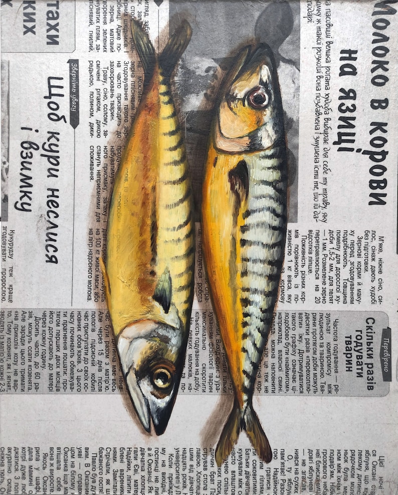 May include: Oil painting of two mackerel fish, side-by-side, on a newspaper background. The fish have yellow and silver scales, with dark eyes and fins. The newspaper text is in Ukrainian.