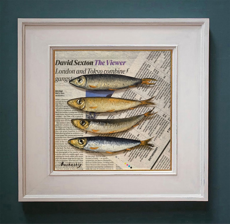 May include: A framed print of a newspaper clipping with the title "The Viewer" by David Sexton. The clipping features a painting of five silver fish arranged in a row on a newspaper background.