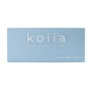May include: A light blue box with the text "koiiia 100% mulberry silk beauty sleep. redefined." printed in white.