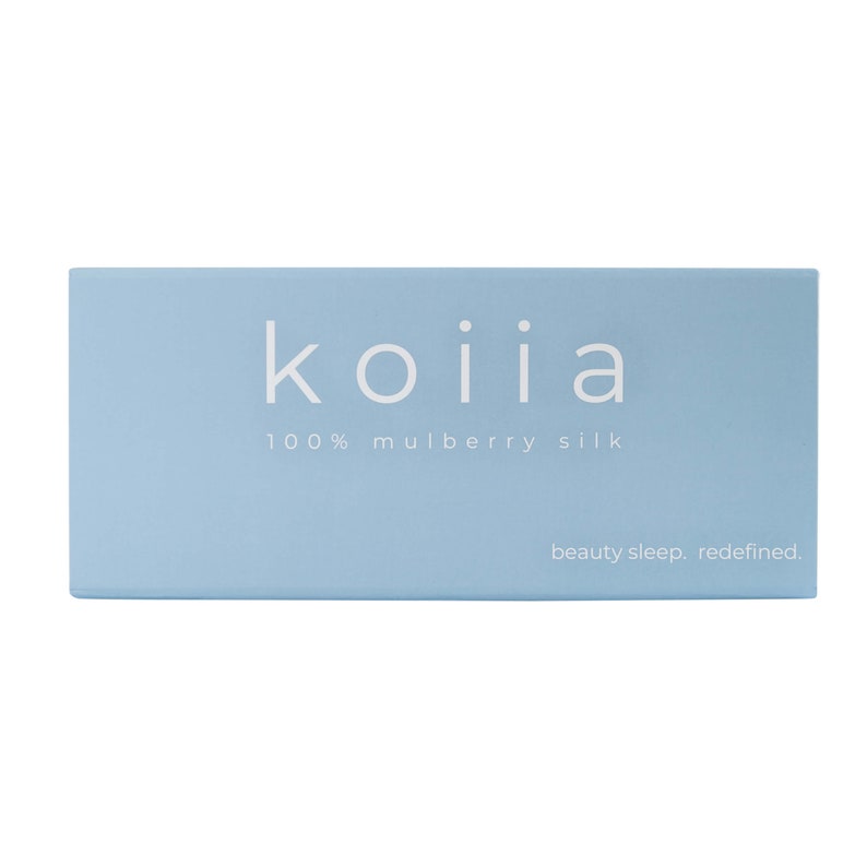 May include: A light blue box with the text "koiiia 100% mulberry silk beauty sleep. redefined." printed in white.