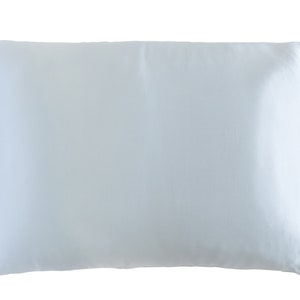 May include: A light blue satin pillowcase. The pillowcase is smooth and wrinkle-free.