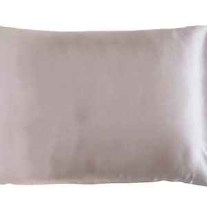 May include: A light pink satin pillowcase. The pillowcase is smooth and wrinkle-free.