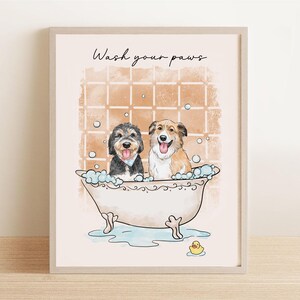 May include: A framed print featuring two dogs in a bathtub with bubbles. The dogs are a black and gray terrier mix and a brown and white Collie. The text "Wash your paws" is written above the dogs.