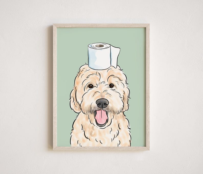 May include: A light brown dog with a white toilet paper roll on its head. The dog is smiling with its tongue sticking out. The background is a light green color.