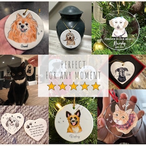 May include: A collection of custom pet memorial ornaments featuring hand-painted portraits of dogs and cats on round and heart-shaped ceramic or glass surfaces. Each piece includes the pet's name, dates, and decorative heart icons, suspended by gold or red strings.