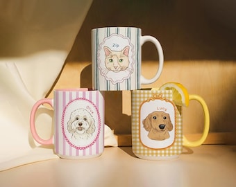 May include: Three ceramic mugs with pet portraits. One mug features a cat named "Zip" on a striped background. Another mug has a dog named "Olive" on a pink striped background. The third mug has a dog named "Lucy" on a yellow checkered background.