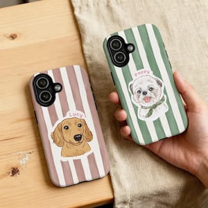 May include: Two phone cases with dog illustrations. One case has a dachshund with the name "Lucy" on a pink and white striped background. The other case has a white dog with the name "Poppy" on a green and white striped background.