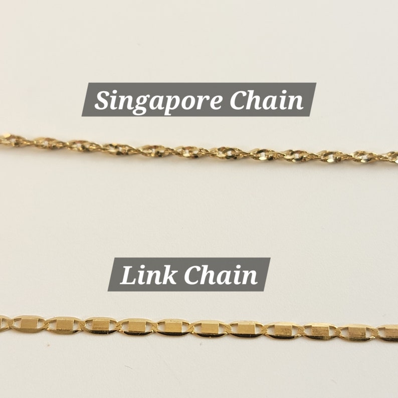 May include: Two gold chains, one is a Singapore chain and the other is a link chain.