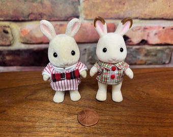 Sylvanian Families - Calico Critters chocolate bunny and tan bunny