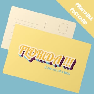 May include: A yellow postcard with the word "FLORIDA!!!" in a retro font, with a purple and blue shadow effect. The text "IS ONE HELL OF A DRUG" is below. A second postcard is visible in the background, with lines for writing.
