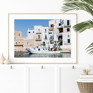 Coastal photography print of a boat in a marina in the town of Monopoli in Puglia, Italy.
