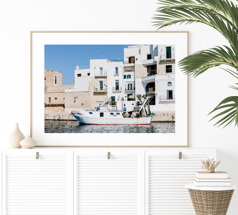 Coastal photography print of a boat in a marina in the town of Monopoli in Puglia, Italy.