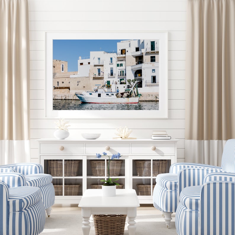 Coastal photography print of a boat in a marina in the town of Monopoli in Puglia, Italy.