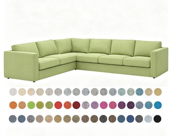 May include: A light green L-shaped sectional sofa with a structured frame, flat seat cushions, and rectangular back cushions. Below the sofa, a grid of sixty-three small circular fabric swatches displays a wide variety of solid colors and textures.