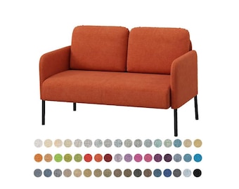 May include: Orange two-seater sofa with black metal legs. The sofa has a simple, modern design with a textured fabric. A color palette of fabric swatches is displayed below the sofa.