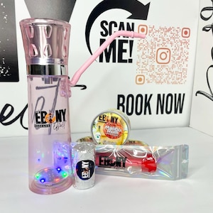 May include: Pink glass hookah with a clear base and a pink hose. The base has a light-up feature with multi-colored lights. The hookah is packaged with a small bag of shisha tobacco, a small bag of charcoal, and a small bag of flavored shisha.