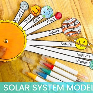 May include: A colorful solar system model with planets labeled and smiling faces. The sun is orange with a gold center. Includes markers in various colors. The text "SOLAR SYSTEM MODEL" is at the bottom.