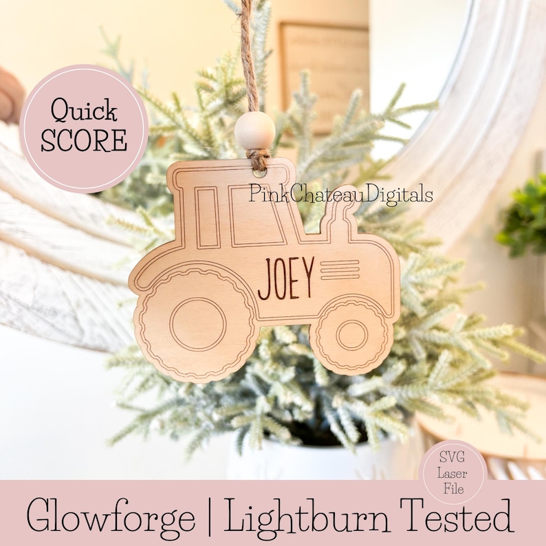 May include: A wooden tractor ornament with the name "JOEY" engraved on it. The ornament is light brown and has a rustic, laser-cut design. It hangs from a twine string with a wooden bead. The text "Quick SCORE" and "PinkChateauDigitals" are also visible.
