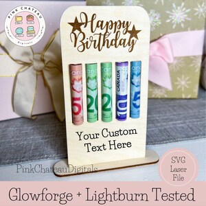 May include: A wooden birthday card with a slot for cash. The card is decorated with the words "Happy Birthday" and two stars. The card has a slot for four bills. The card is designed to be used with a Glowforge or Lightburn laser cutter.