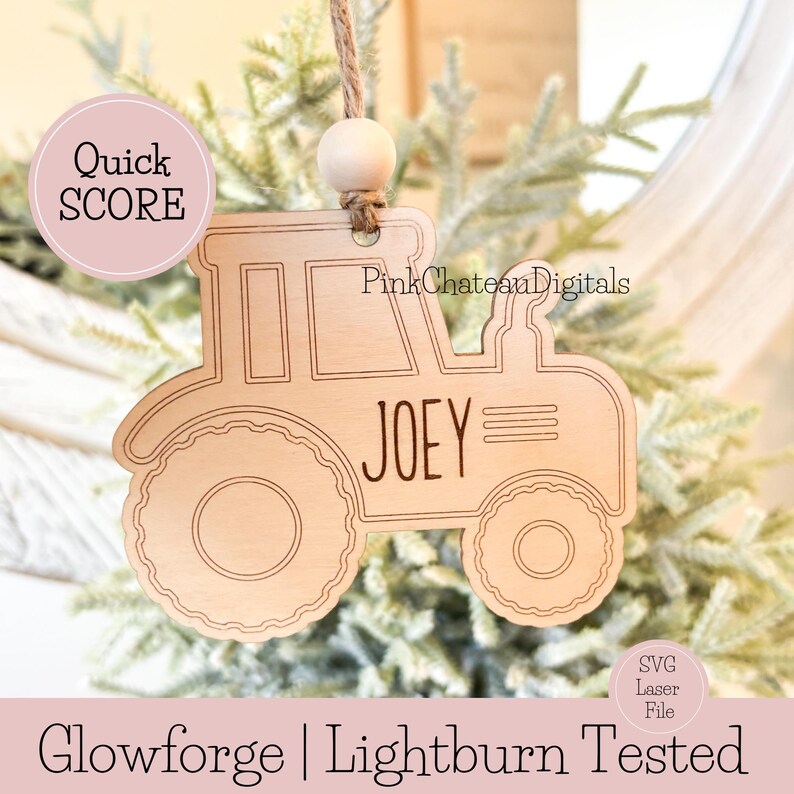 May include: A wooden tractor ornament with the name "JOEY" engraved on it. The ornament is hanging from a twine string with a wooden bead. The text "Quick SCORE" and "Glowforge | Lightburn Tested" are also visible.