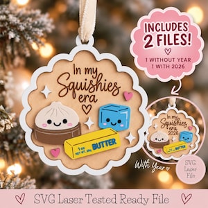 May include: A scalloped wooden ornament featuring the text In my Squishies era, a dumpling, a blue cube, and a yellow stick of butter labeled 1 oz NET WT. 28g. Includes two SVG laser files, one with the year 2026 and one without the year.