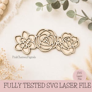 May include: A light brown wooden floral design, comprising three flowers: a star-shaped bloom, a rose, and a smaller rose. The text "FULLY TESTED SVG LASER FILE" is at the bottom. The design is set against a neutral background.
