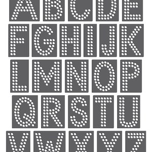 May include: A set of 26 alphabet letters made of gray squares with white circles arranged to form each letter.