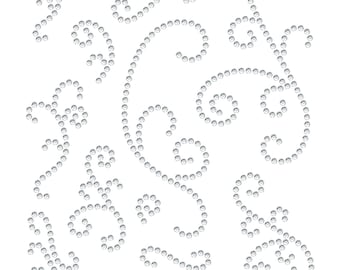 May include: A white background with a design of various swirls and shapes made of small, white, round rhinestones.