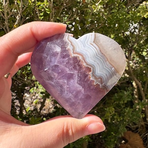 May include: A set of three ceramic mugs with a speckled, matte finish. The mugs are in shades of cream, light gray, and dark gray. Each mug has a simple, minimalist design, perfect for coffee or tea.