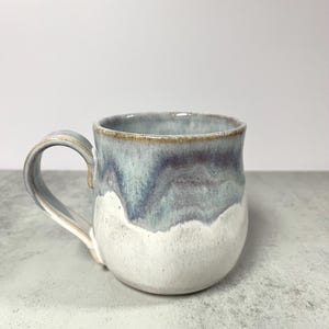 Handmade Drippy Pottery Mug, Creamy Blue and Purple Pottery Mug, Curvy Mug, Stoneware Pottery Mug, Drippy Glaze Mug, Housewarming Gift