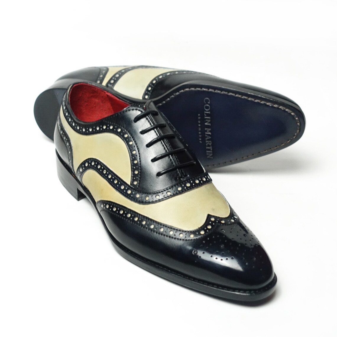 black and white spectator flats